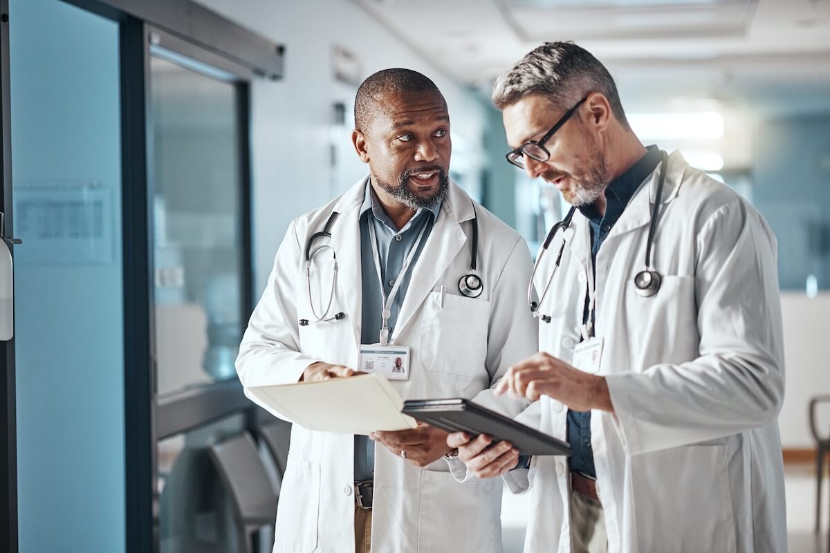 two clinicians reviewing chart
