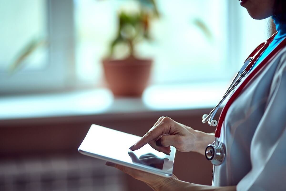 clinician using tablet with finger.jpeg