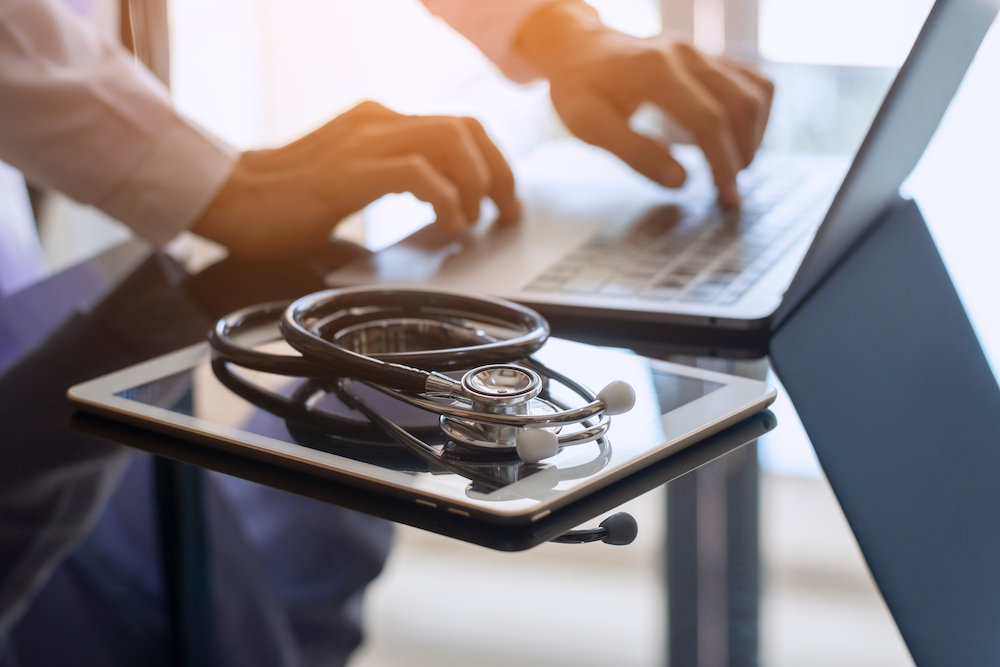 Doctor using laptop