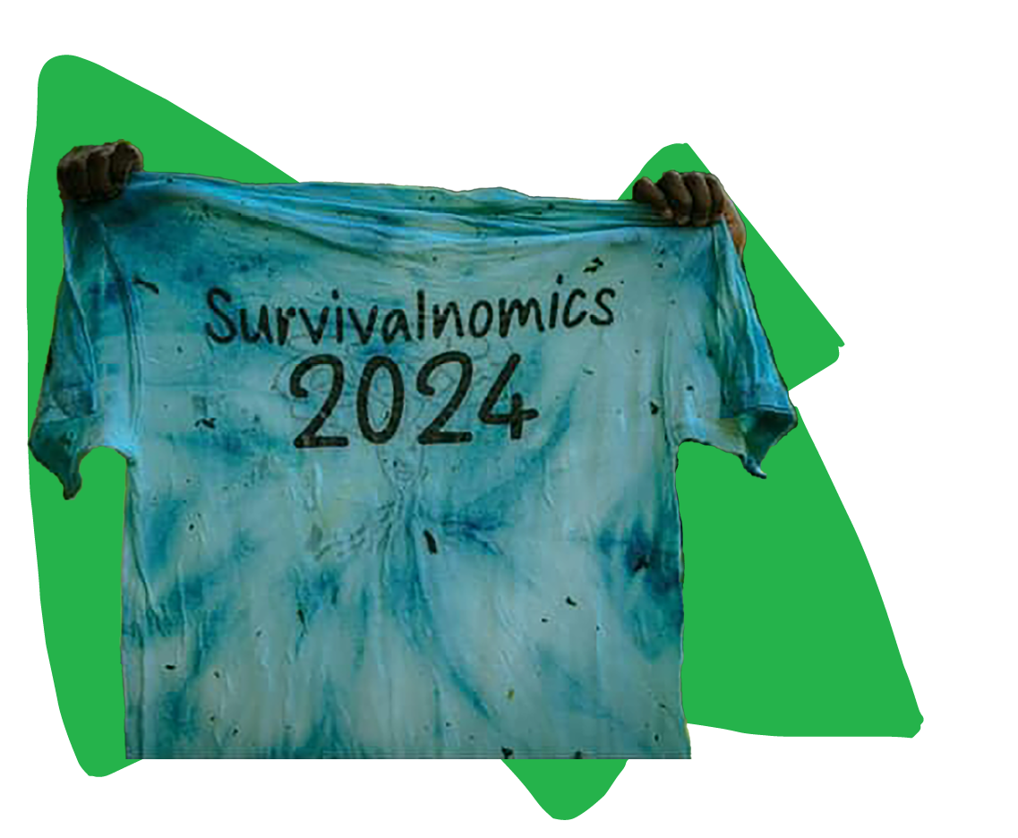 A photograph cutout of someone holding up the fully blue dyed shirt, that has ”Survialnomics 2024” written on it, placed over a green geometric shaped graphic