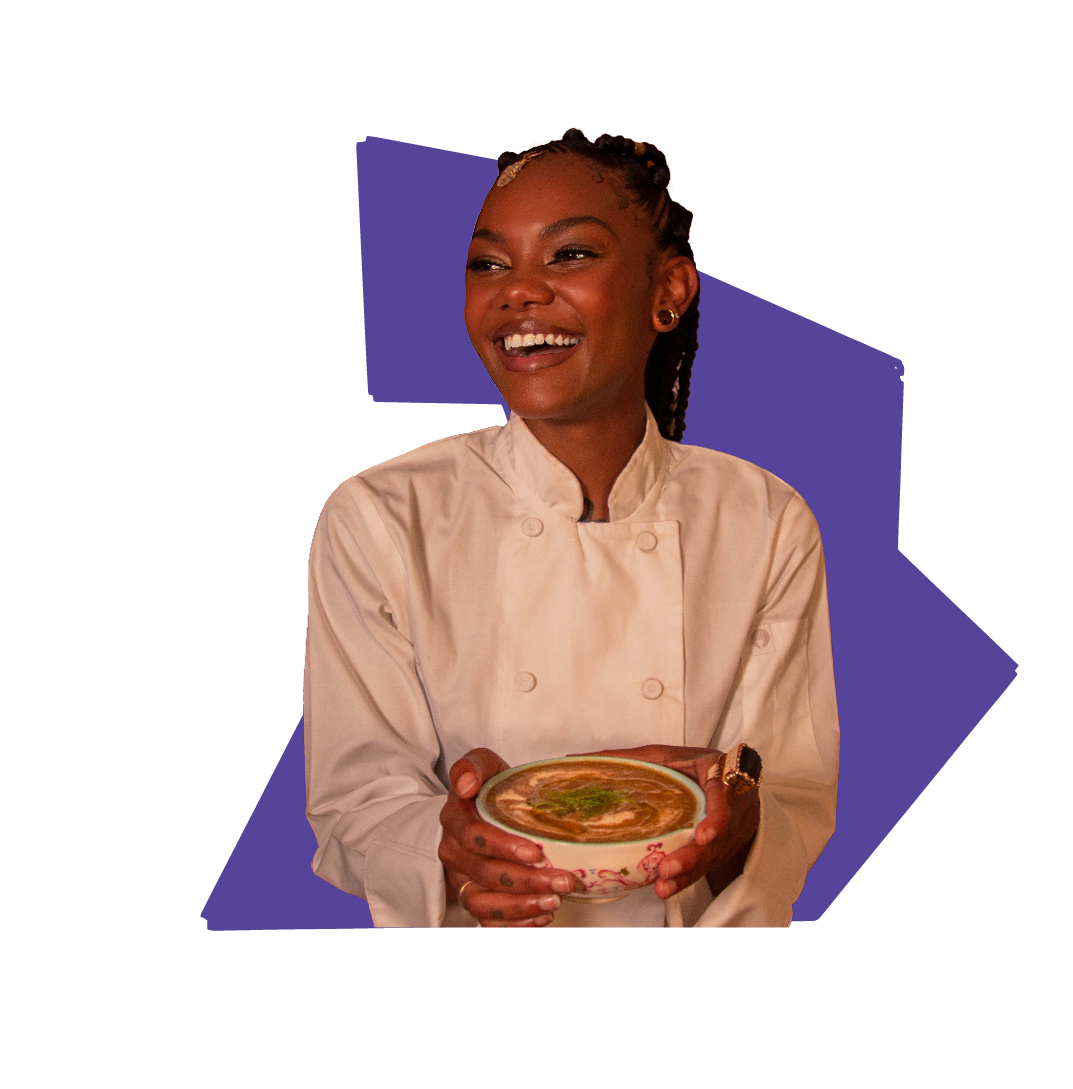 Chef Cole Lawson, happily posing with a bowl of food she cooked