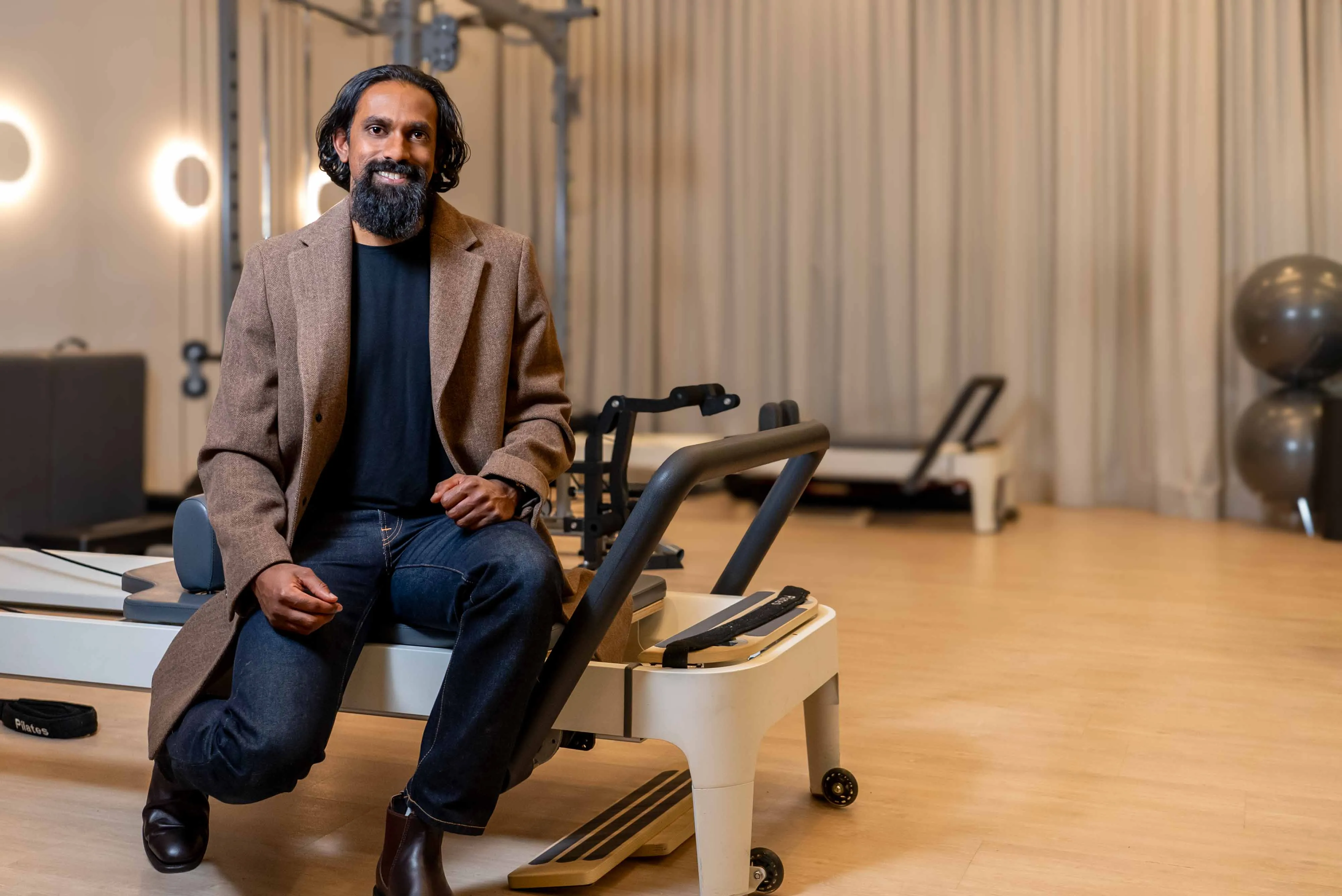 Shane with a welcoming smile, inside a physiotherapy clinic