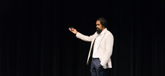 Shane Gunaratnam on stage at the Physio Symposium
