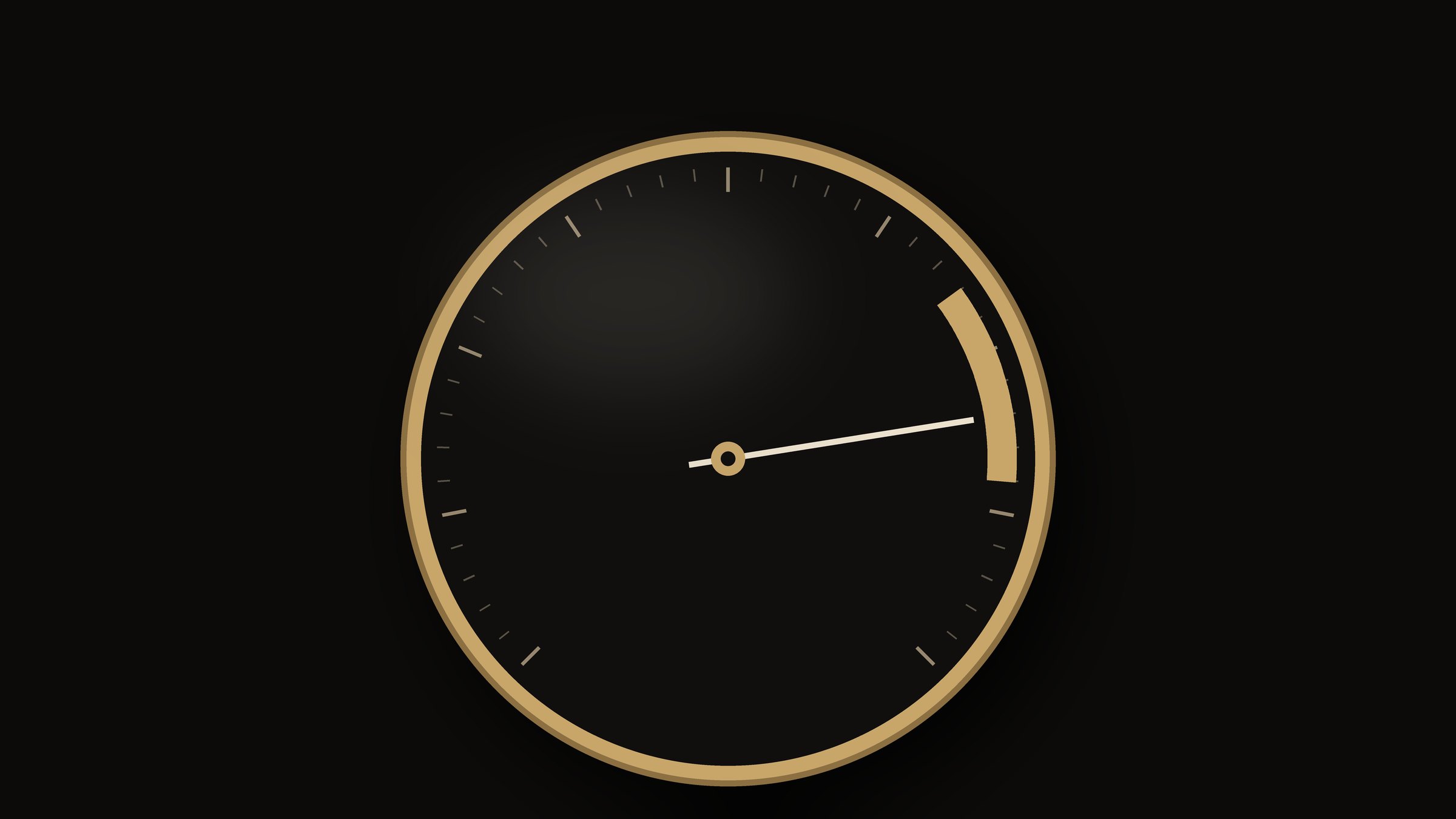 A brass dial on dark slate with its needle sitting in a narrow marked band, lit by one warm light from the upper left