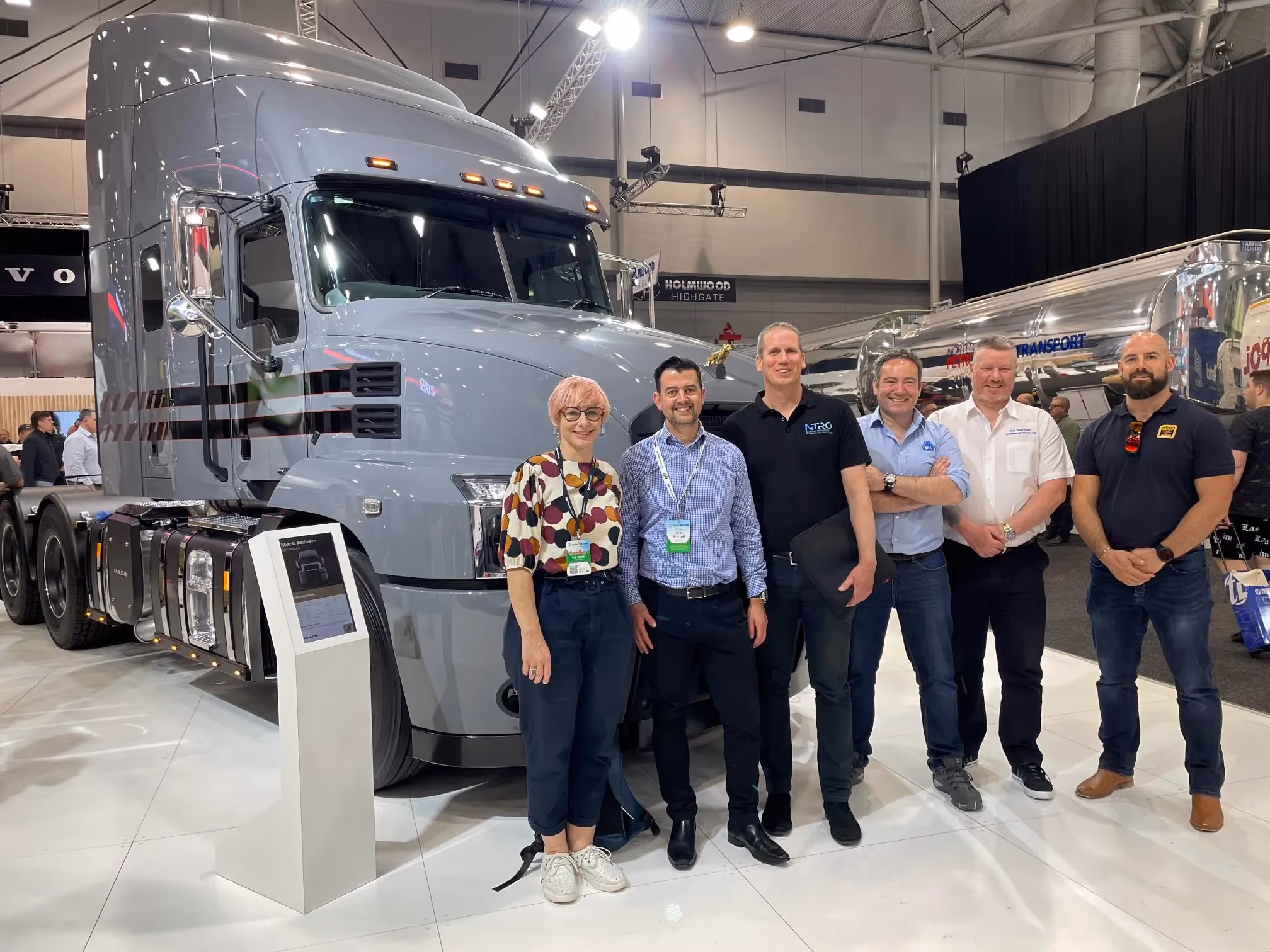 NTRO and TruckShowX representatives in front of zero emissions truck