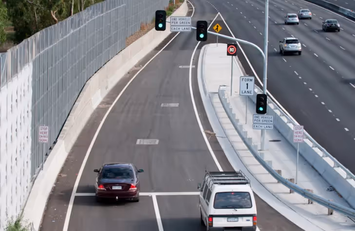 Traffic on motorway approach about to enter motorway