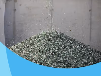 Recycled glass pouring into a pile