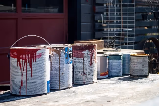 Used paint cans lined up