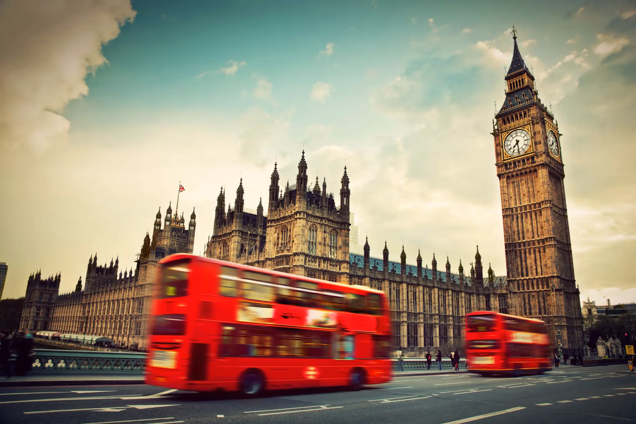 Moving London bus driving past Big Ben