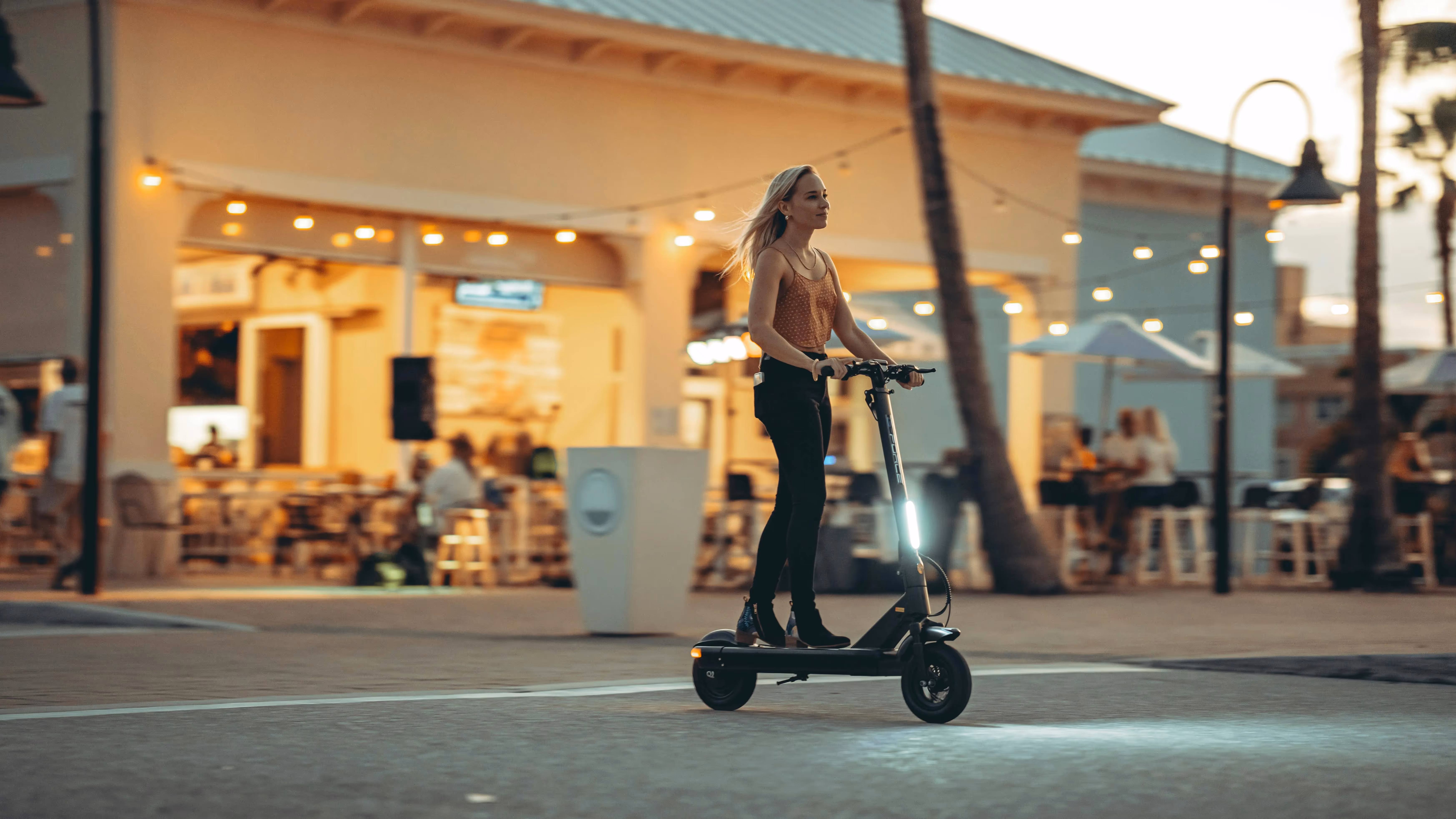 Woman riding e-scooter