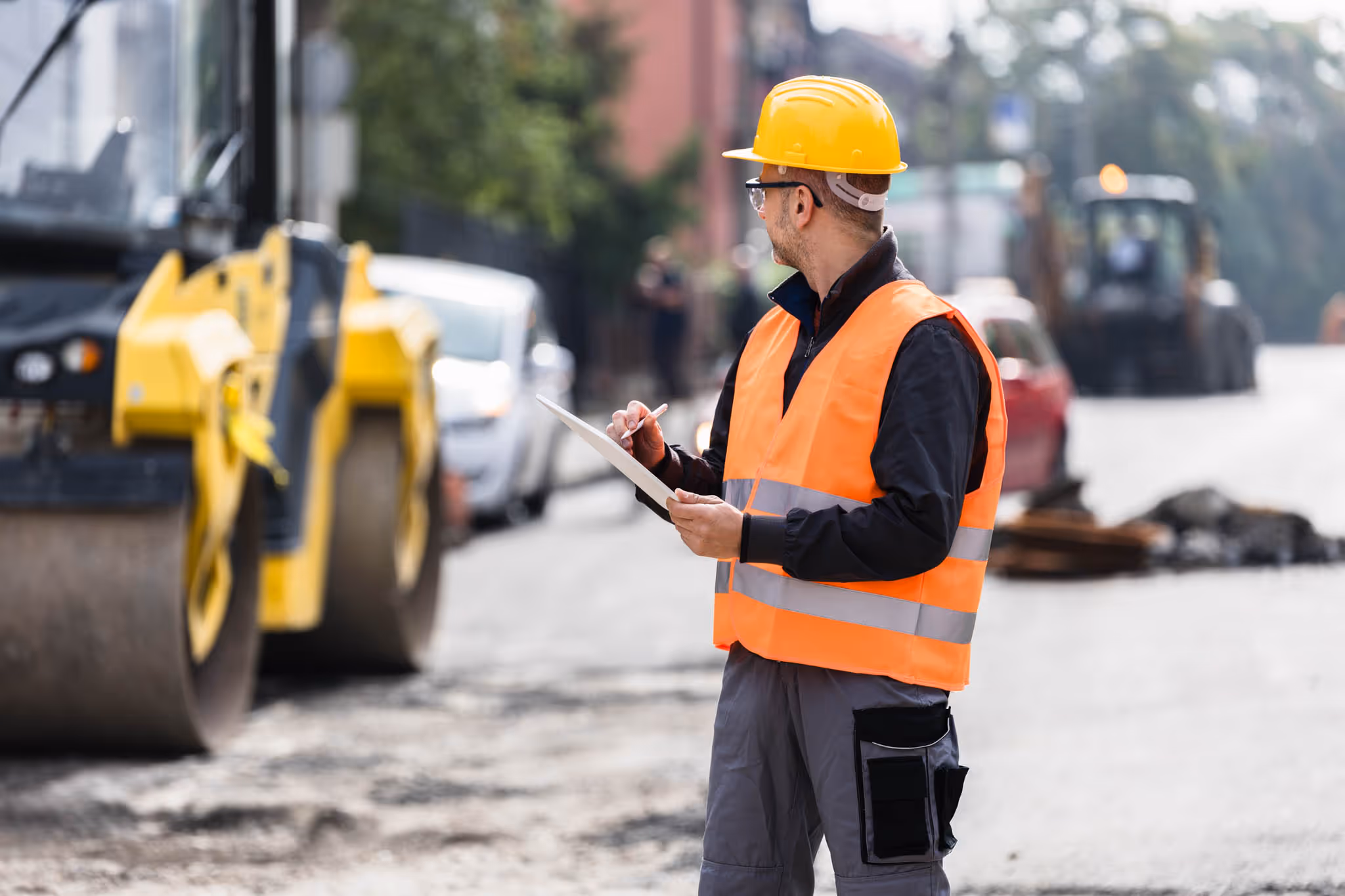 Person on a road conducting an assessment.