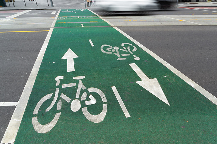 Road with green cycling lane.