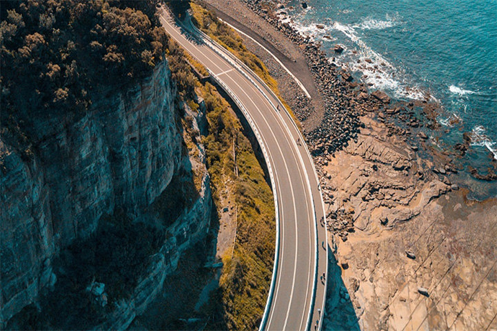 Bridge winding around acliff on the Australian coastline.