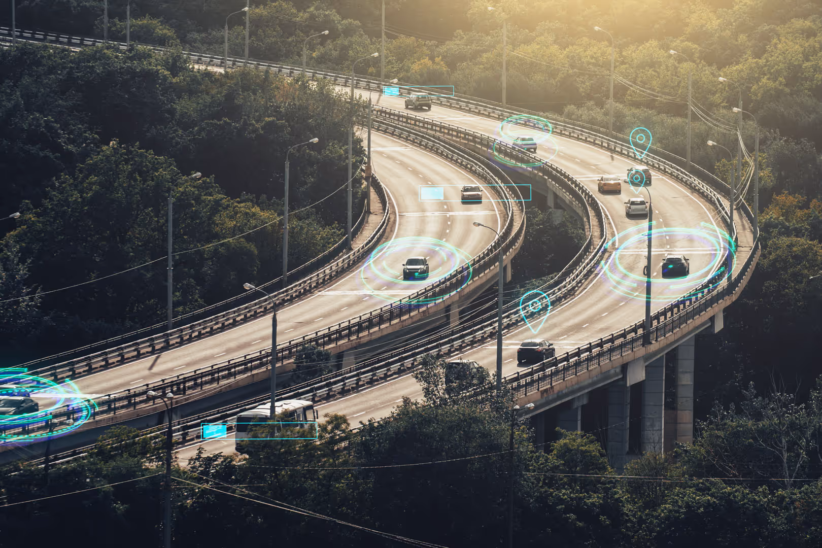 Vehicles driving over a bridge with holographic elements circling them.