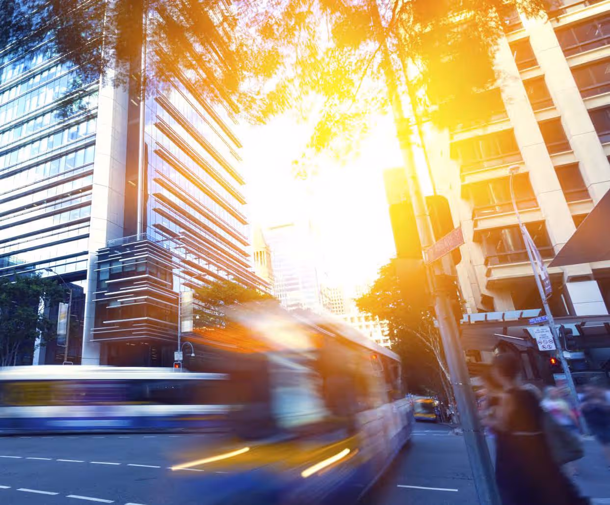 Blurred public transport moving fast on a road.