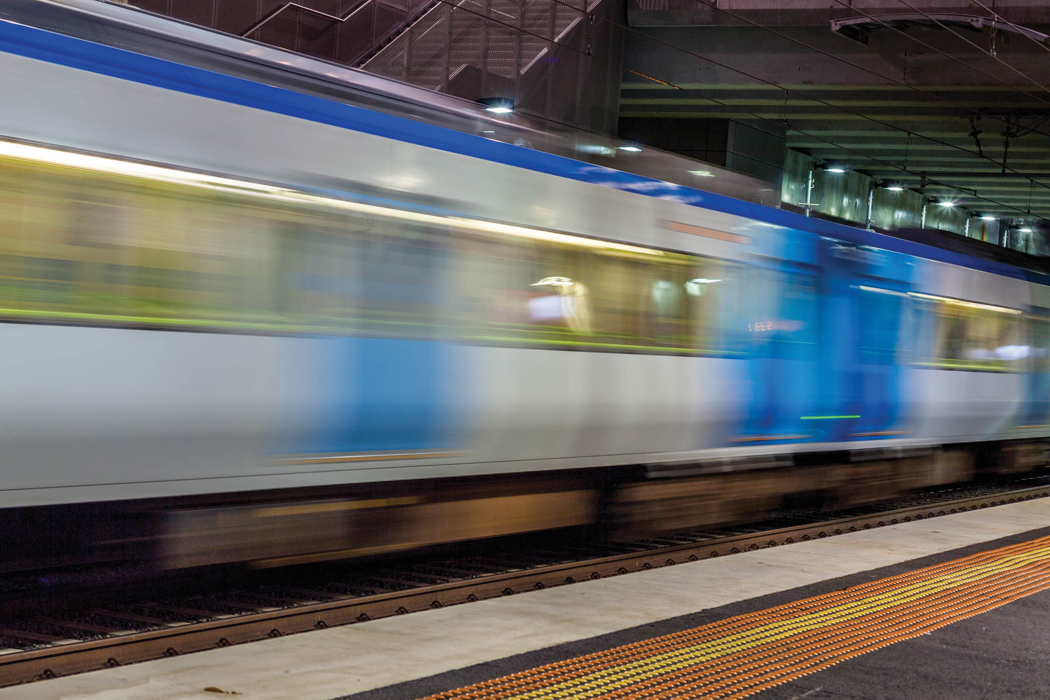 Blurred train moving at a Melbourne train station
