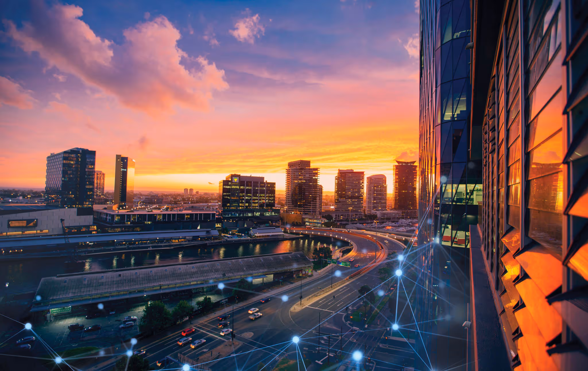 Cityscape with motorway going through it.