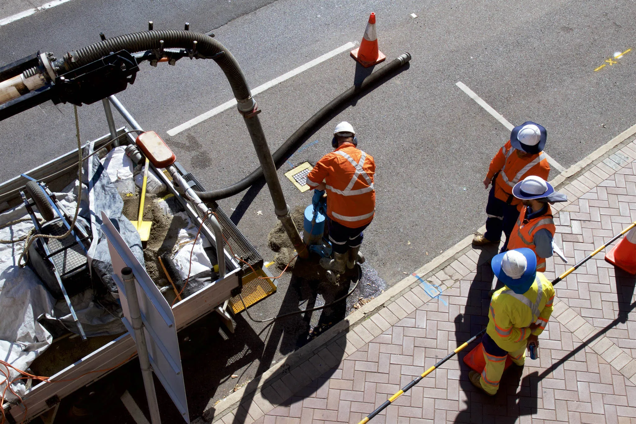 People working on an asphalt road