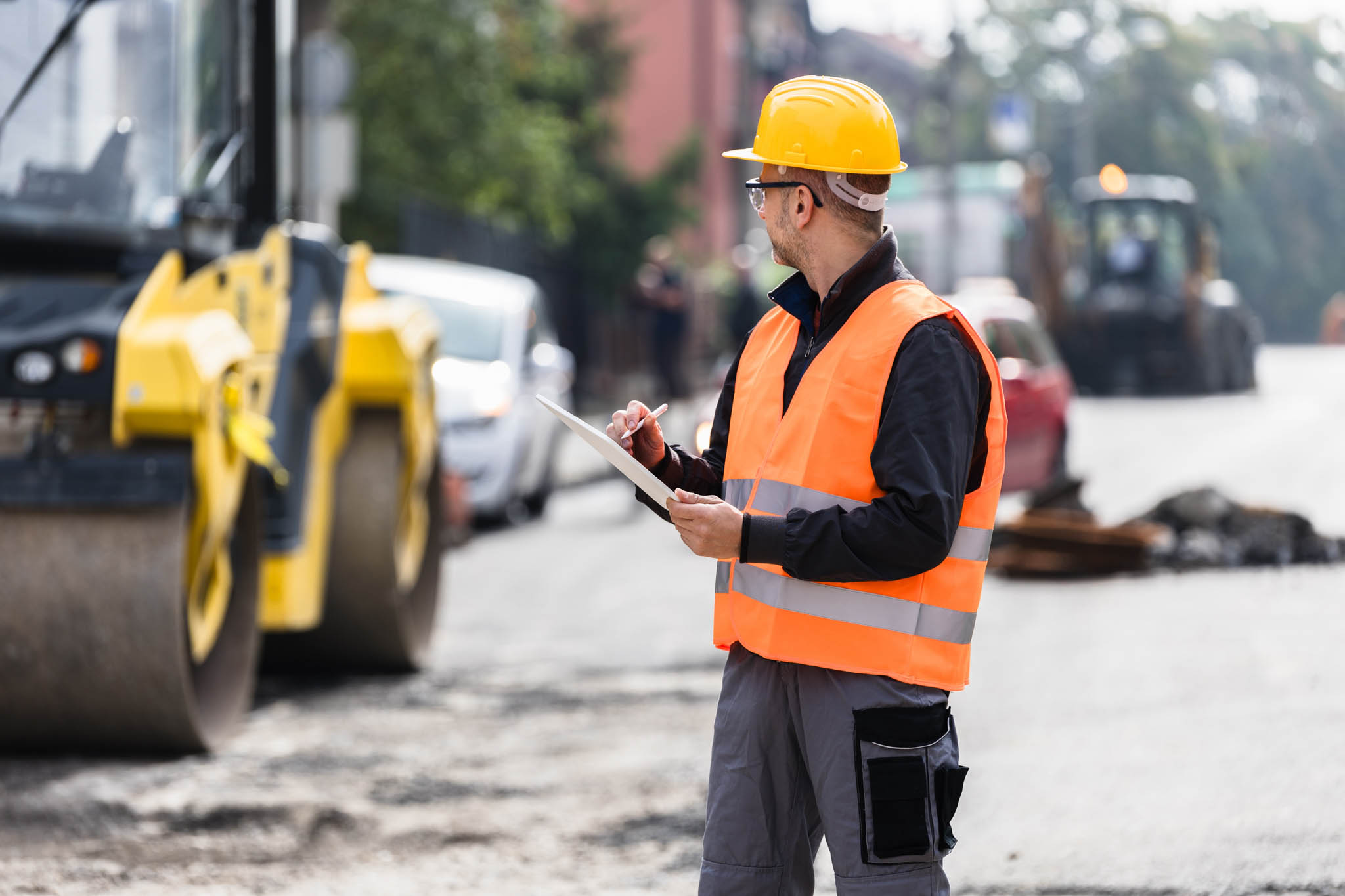 Person on a road conducting an assessment.
