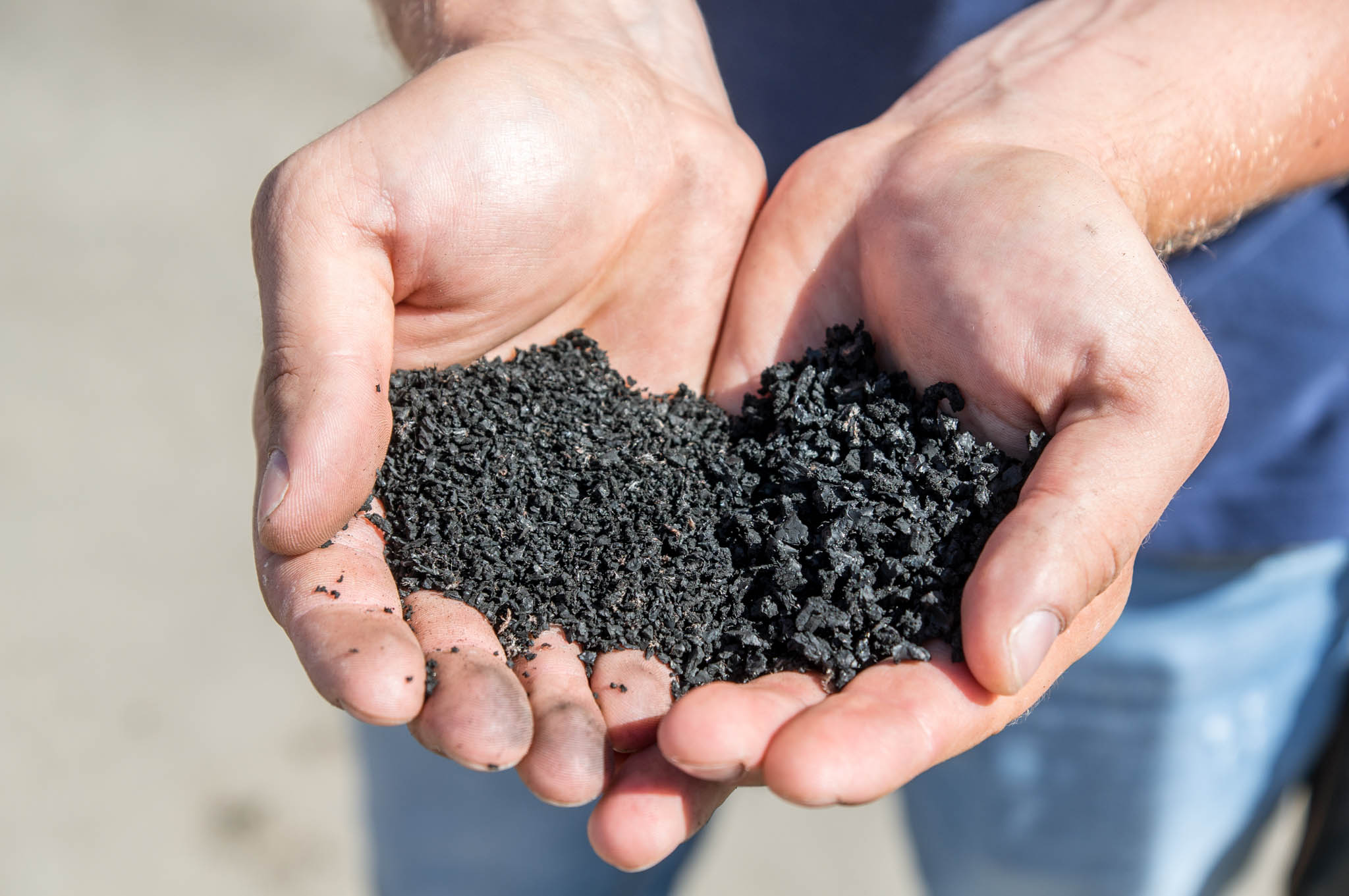 Person holding crumb rubber