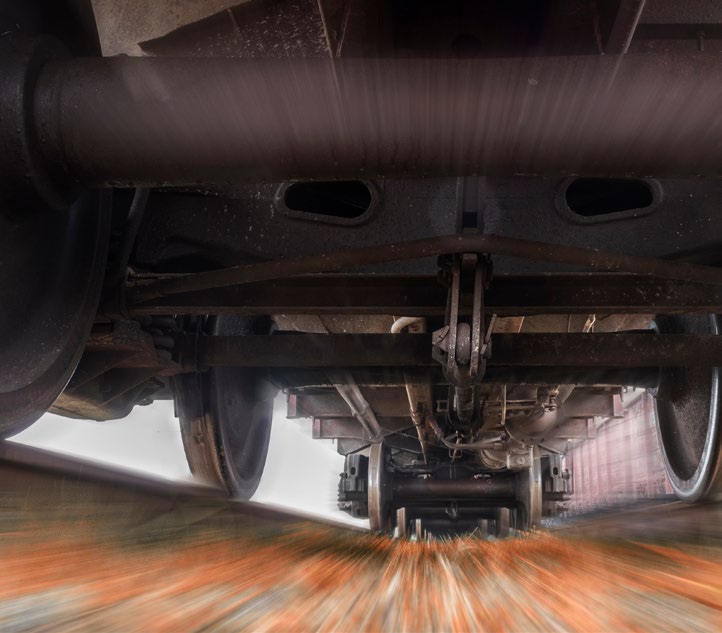 Close up of the underside of a train.