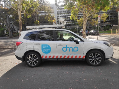 A white car parked on the side of a roadAI-generated content may be incorrect.