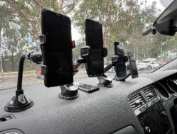 A group of phones on a car dashboardAI-generated content may be incorrect.