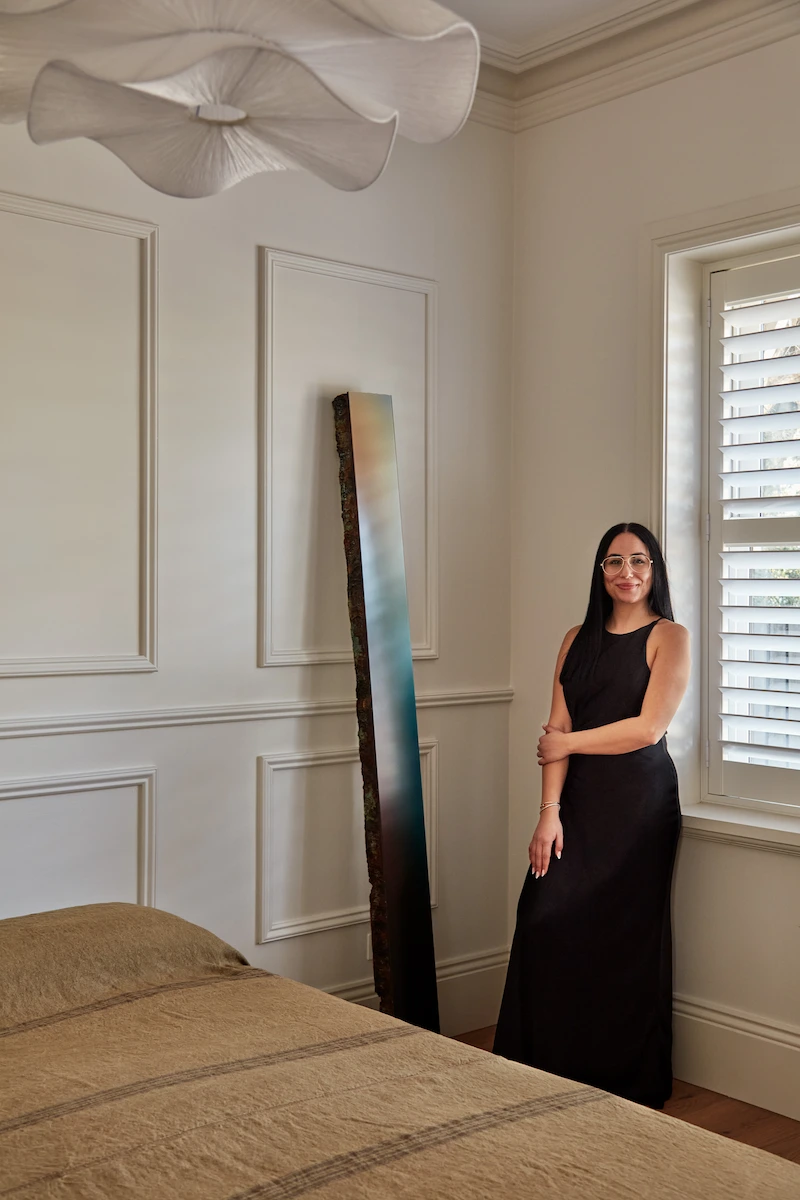 A women standing in a modern bedroom