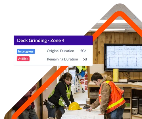 Construction Workers working on a Schedule in their trailer