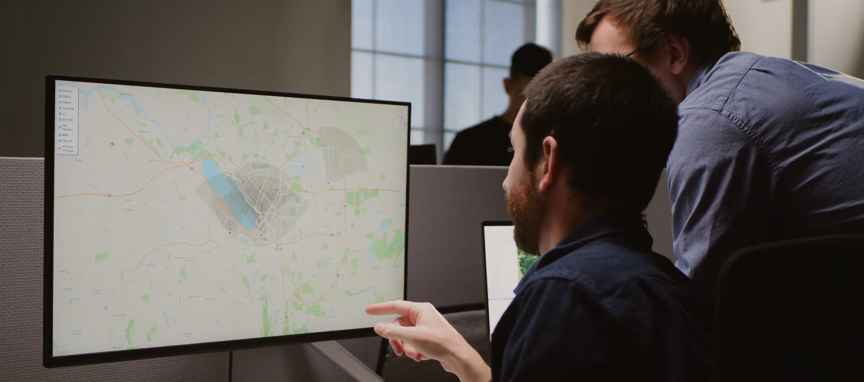 Two man discussing a map
