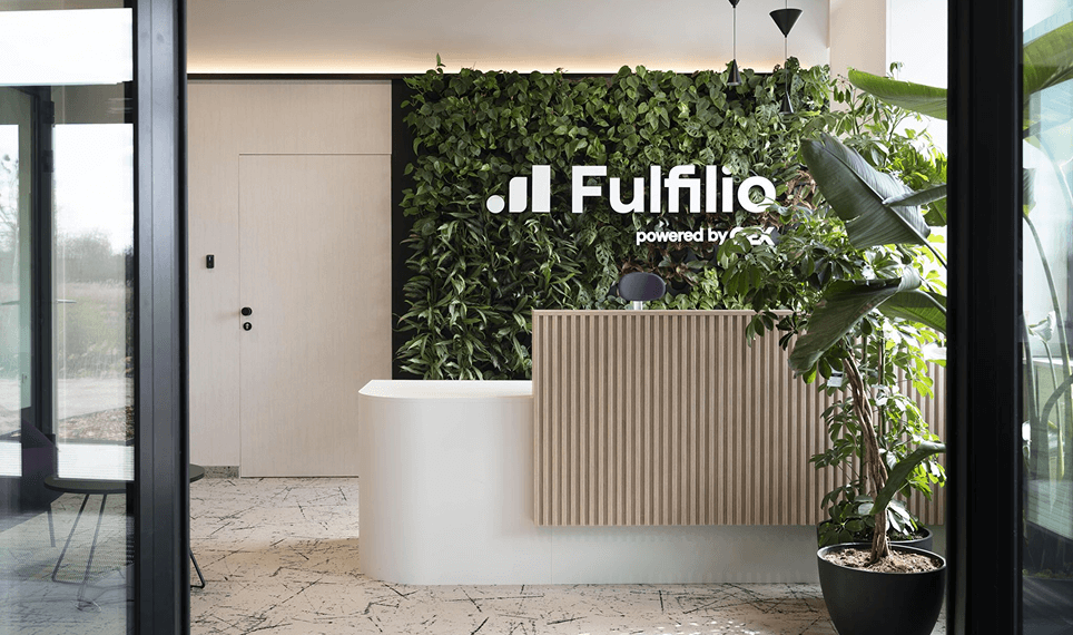 Reception area of Fulfilio Sp. z o.o. with a company logo on the living wall.