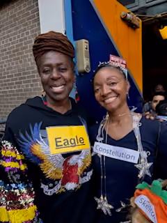 Two students displaying Eagle and Constellation science fair projects