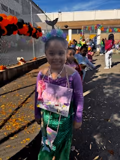 Student dressed as a mermaid at school Halloween parade