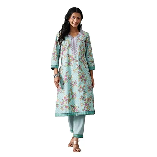 Model in a light turquoise floral print kurta with matching wide-leg palazzo pants.