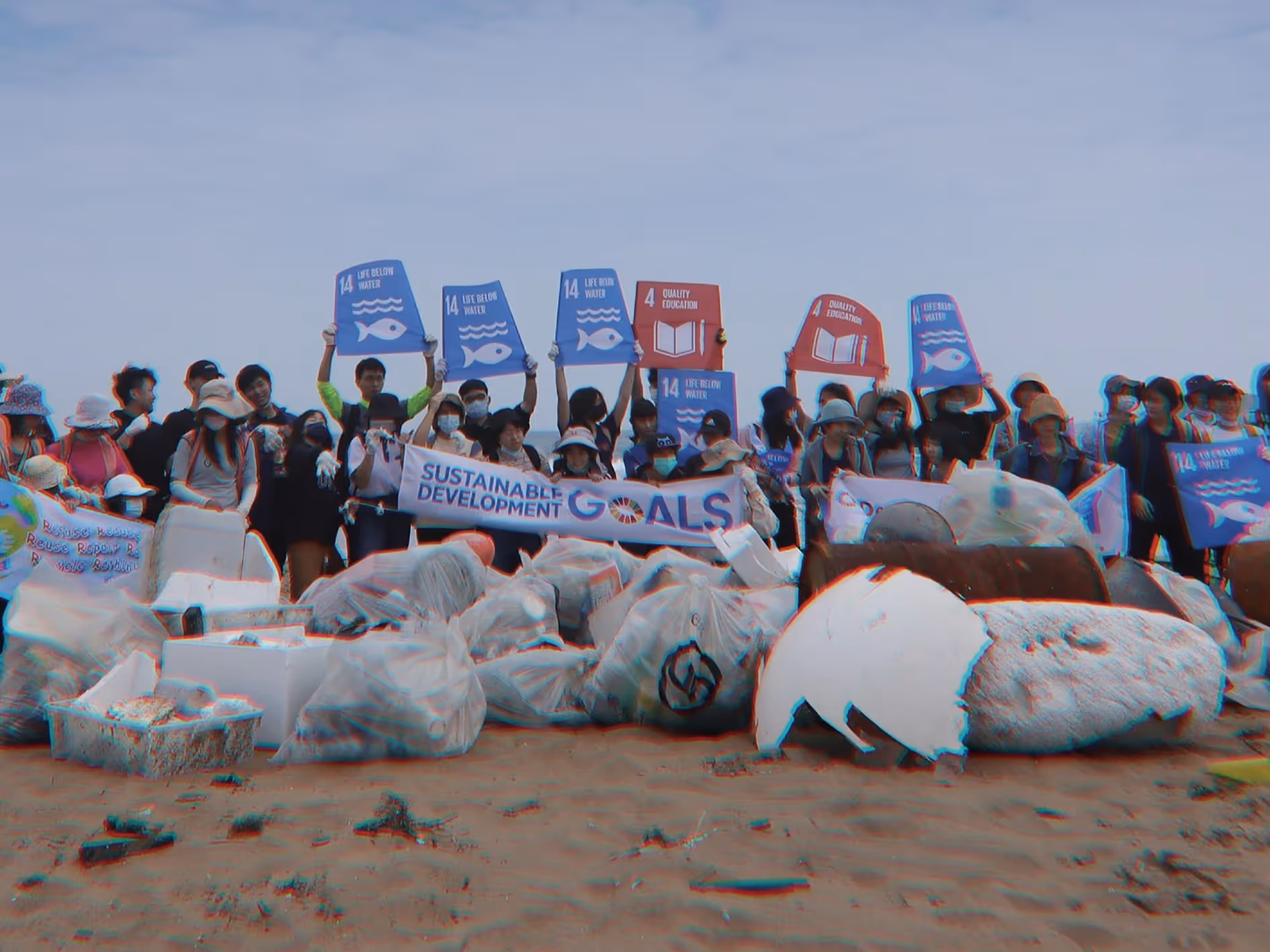 Faculty and students from the Industrial Design Department at Taipei Tech (National Taipei University of Technology), alongside representatives from their partner Lite-On Technology, pose for a group photo after a beach cleanup at Jinshan Tiaoshi Coast in Taipei. The activity was part of the "SEA HOPE Lite-On Ocean Day" sustainability project, an action project designed to address UN Sustainable Development Goal 14 (Life Below Water).