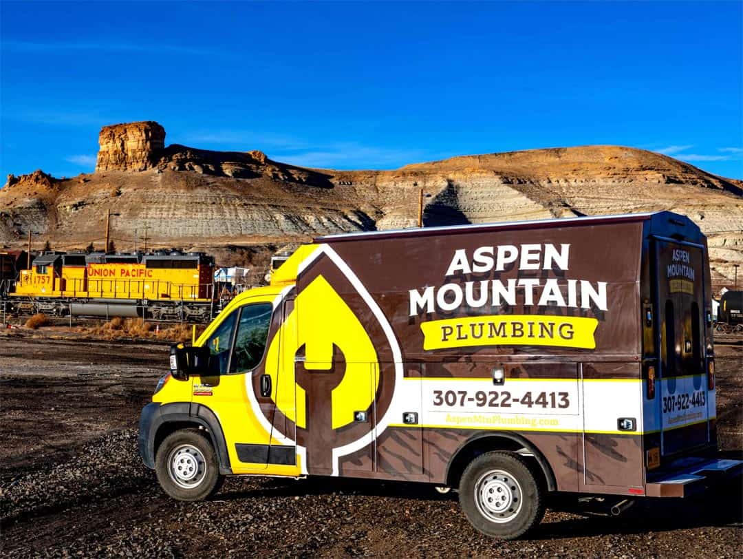 An Aspen Mountain Plumbing Service Van With The Famous Golden Leaf Logo.