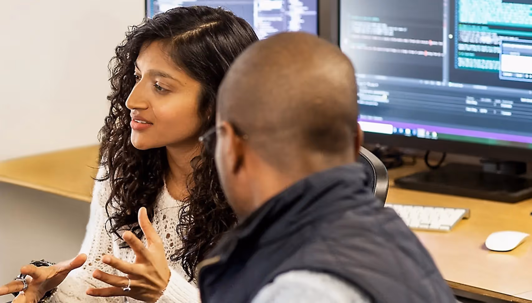 Developers chatting in office setting