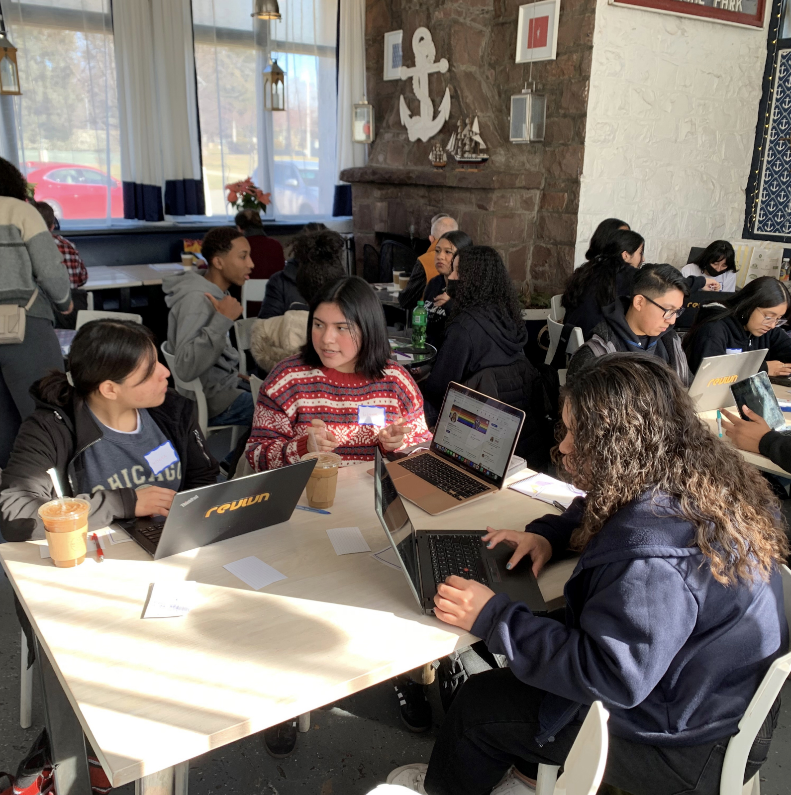 Students at tables with laptops