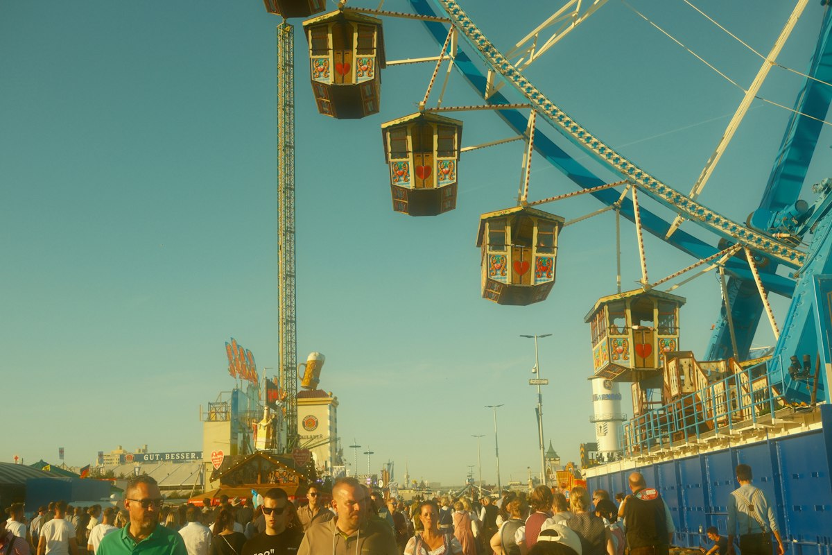 Festival crowd and ferris wheel