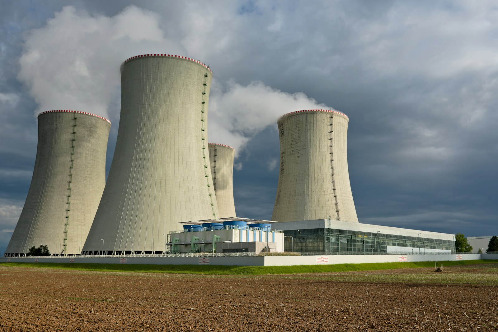 Nuclear power station cooling towers beneath a cloudy sky