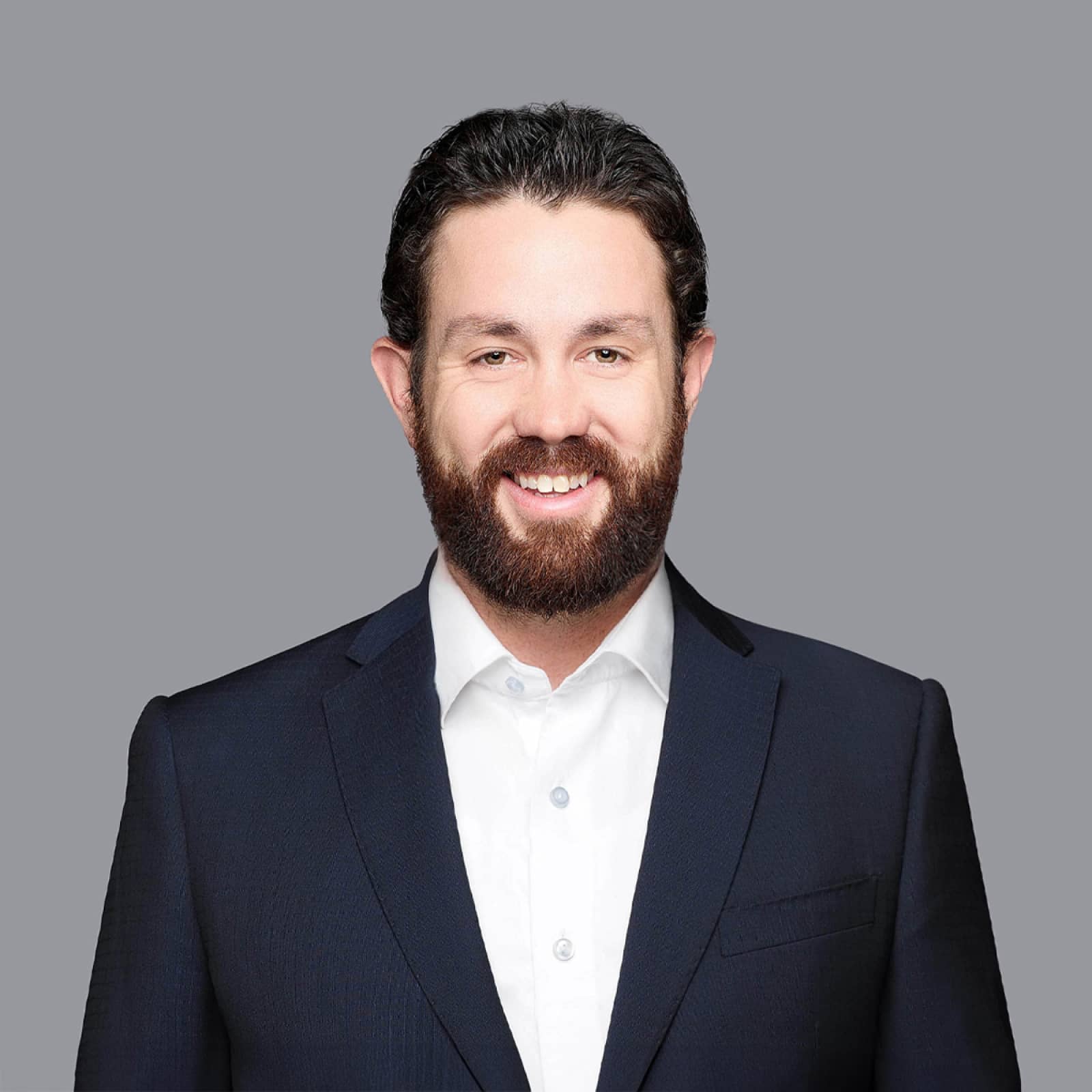 Andrew Kent headshot in a dark suit with white shirt