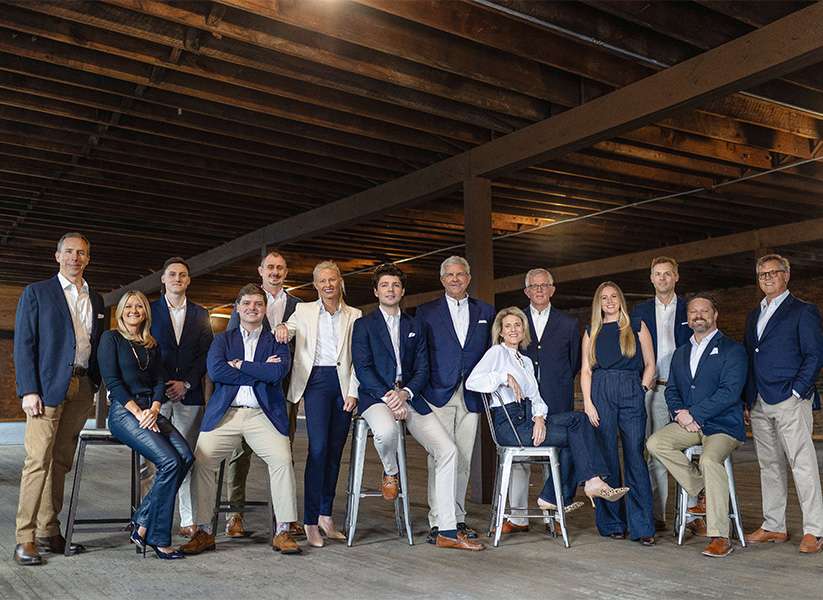 Team photo of the Robinson Team outside of Keller Williams Downtown Chattanooga office