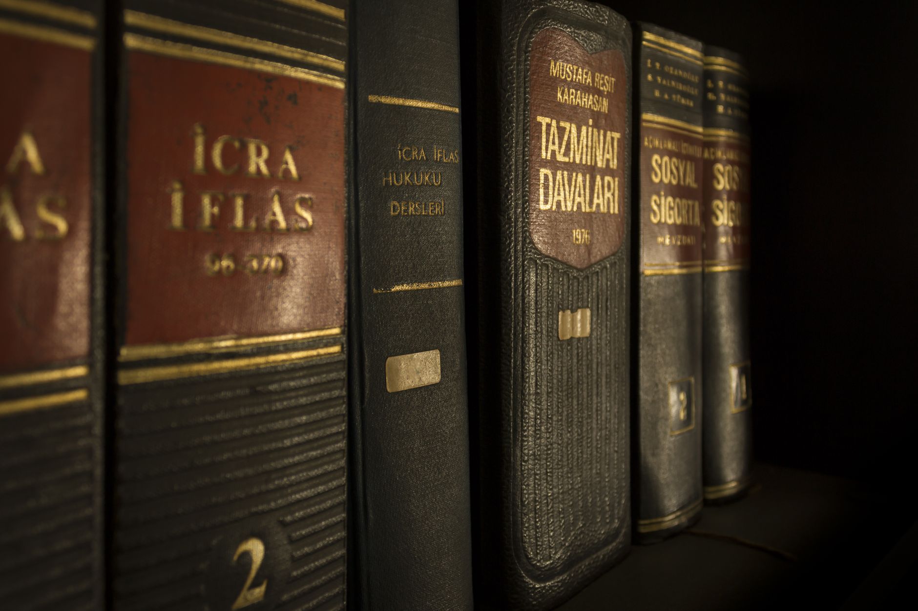 Law and regulation books on a bookshelf, symbolising the knowledge foundation required for effective legal AI implementation.