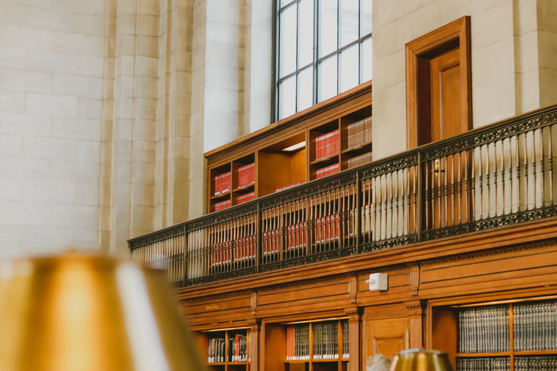 Classic wooden library shelves and railing, symbolising the foundation required for trustworthy legal AI research.