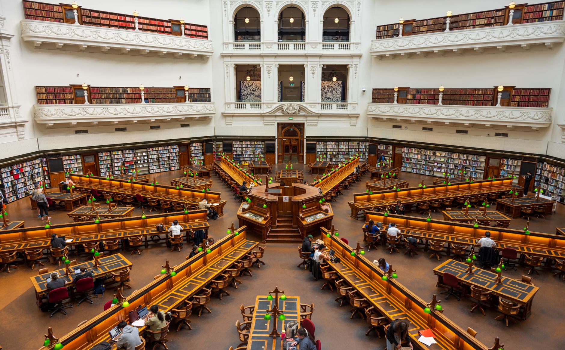 Grand library interior with readers, symbolising the foundational trust and verifiable sources essential in legal AI research.