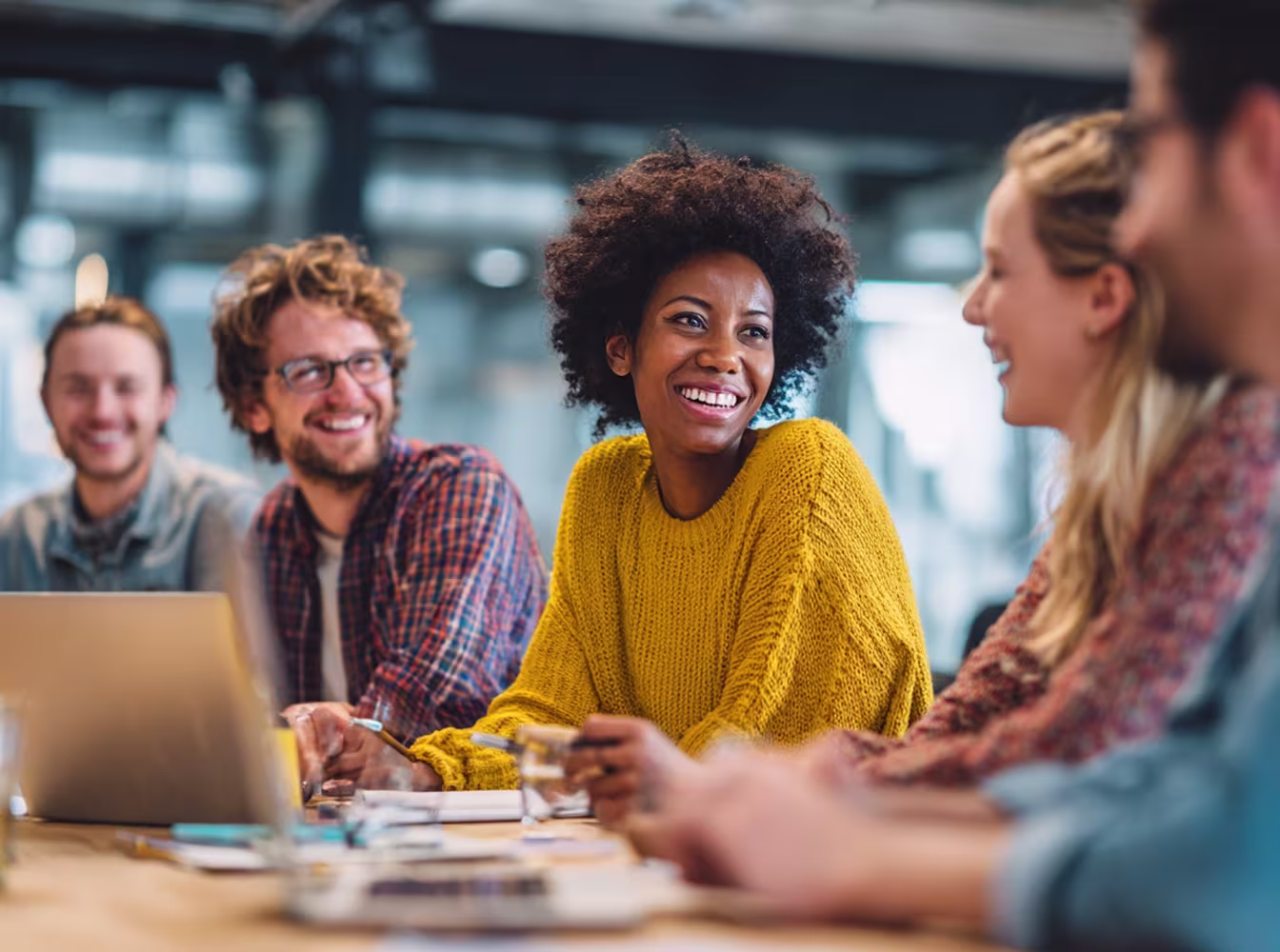 Diverse nonprofit technology team meeting
