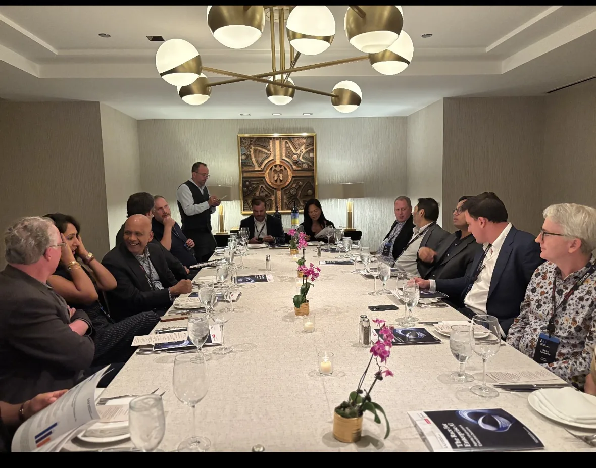 Executives in conversation at a previous Leaders in AI private dinner