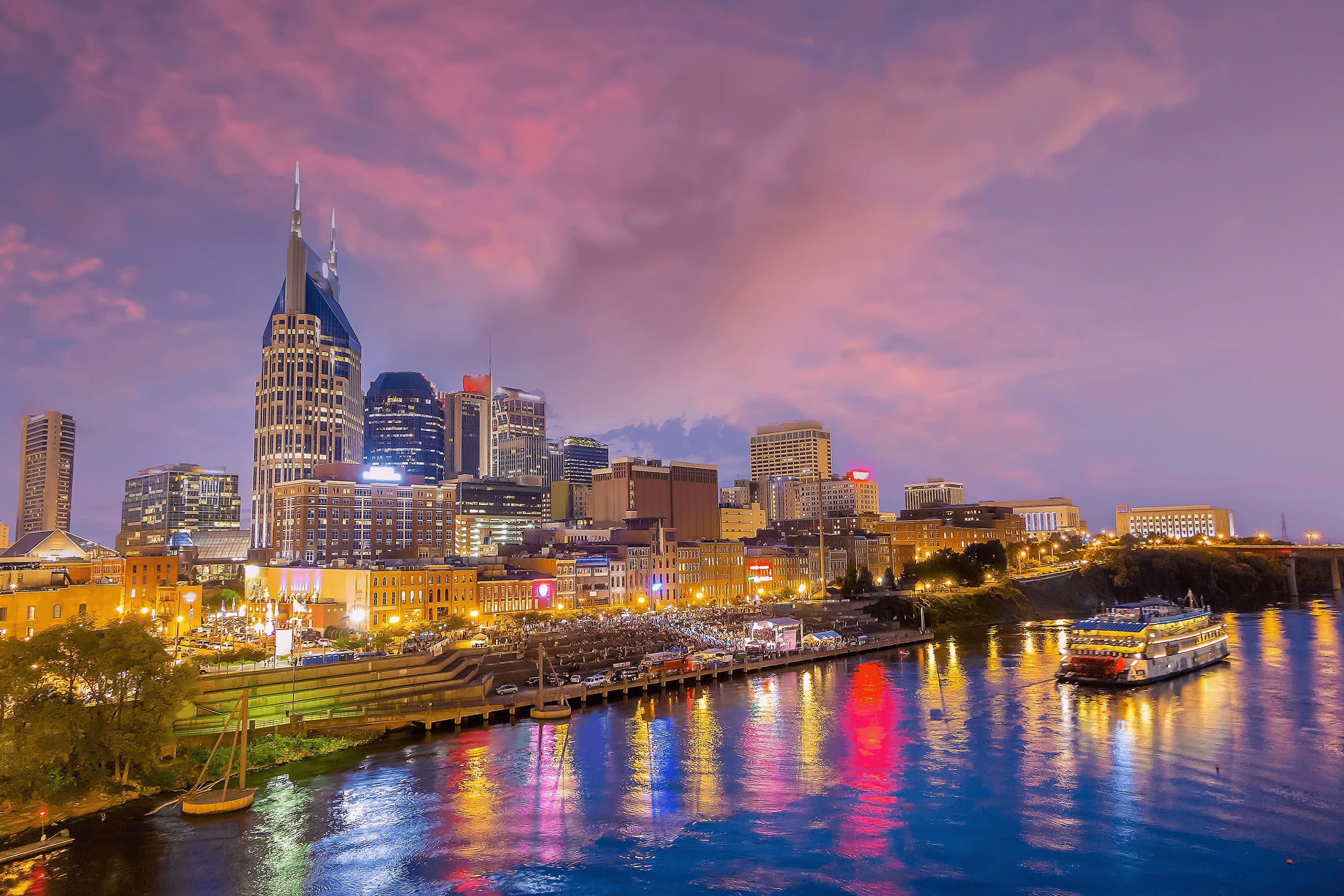 Downtown Nashville skyline and riverfront at dusk