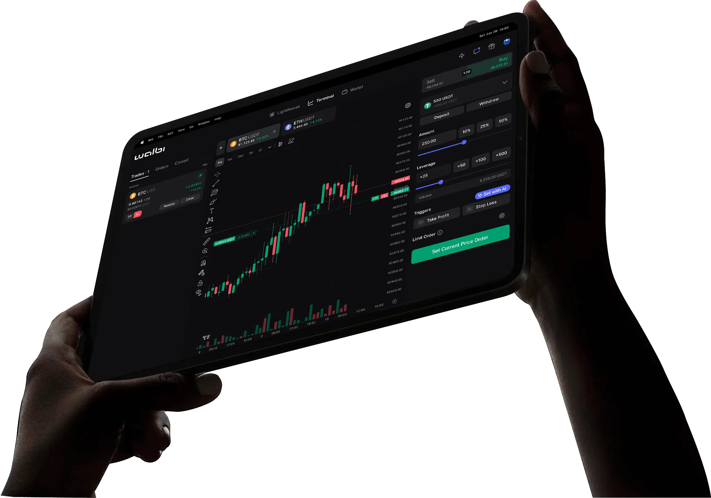 2 hands holding an ipad with the walbi crypto trading app open