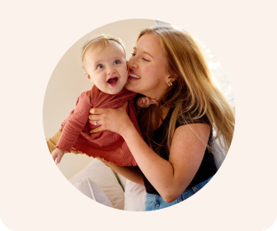 a woman holding a baby